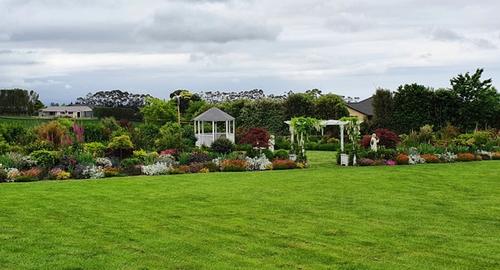 Soil creates a garden with height to view planting. Enter through the pergola to a hidden garden.