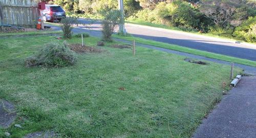 Front Yard Want a flat lawn but live on a slope.