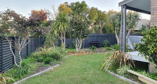 Unkept garden with no feature or charm to make you want to sit on the deck and enjoy your garden.