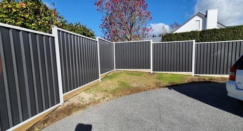 A small triangle garden area that requires a low maintenance garden