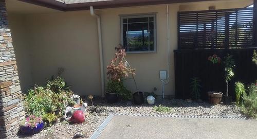 Entrance to house showing a scruffy garden before using landscape imagin