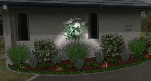 Side of house after using landscape imaging showing night lighting. This creates interest and added security to the house.