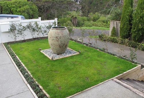 Landscaping Pot Creating a sloping section into a flat section with a water feature.