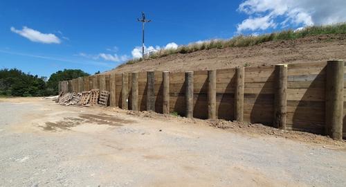 Large retaining wall on entry to the house. 